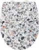 A top-down view of a toilet seat with a terrazzo pattern. Anteprima dell’immagine prodotto