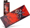 A large mousepad with artwork from Assassin's Creed Shadows is shown diagonally, with its packaging box to the left. Produktbild-Vorschau