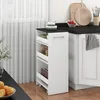 A narrow white roll-out storage unit with shelves and a drawer, placed next to a kitchen counter. Voir les images du produit