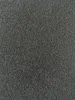 A close-up, textured view of a black bitumen roofing membrane. Produktbild-Vorschau