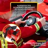 A child in a firefighter costume is driving a red toy electric car. Produktbild-Vorschau