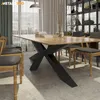 A dining room scene with a wooden table and chairs, set against a backdrop of sheer curtains and a bookshelf. Produktbild-Vorschau