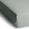 A close-up view of a fitted sheet on a mattress. Produktbild-Vorschau