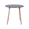 A round black table with three wooden legs, isolated on a white background. Voir les images du produit