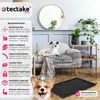 A dog crate is shown in a living room setting with dogs and decorative elements. Produktbild-Vorschau
