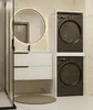 A modern bathroom with a vanity, sink, mirror, and stacked washing machines. Podgląd zdjęcia produktu