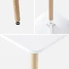 A collage of close-up images showing the details of a white square table with wooden legs. Anteprima dell’immagine prodotto