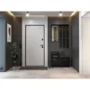 A modern entryway with a white door, a black shoe cabinet, and a coat rack with a mirror. Náhled obrázku produktu