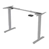 A silver electric standing desk frame with two legs and a control panel. Produktbild-Vorschau