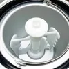 Close-up interior view of an ice cream maker bowl with the paddle. Anteprima dell’immagine prodotto