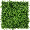A square panel of artificial greenery, resembling a dense hedge or bush, is shown against a white background. Produktbild-Vorschau