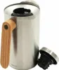 A close-up, angled view of a stainless steel insulated carafe with a wooden handle and an open lid. Voir les images du produit
