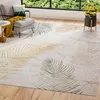 A living room scene with a chair, a rug, and a plant. Produktbild-Vorschau