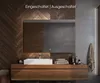 A modern bathroom vanity with a sink and a large mirror, featuring wooden paneling and concrete accents. Produktbild-Vorschau
