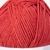 A close-up view of a ball of red yarn. Produktbild-Vorschau
