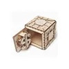 A wooden 3D puzzle safe with its door open, revealing a dollar sign mechanism inside. Produktbild-Vorschau