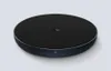 A black wireless charging pad is shown on a light gray background. Produktbild-Vorschau