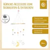 A baby mobile hanging from a wooden bar, with decorative elements like moons, stars, and clouds. Produktbild-Vorschau