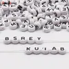 Buchstaben Perlen, 30 Stück, 4x7 mm, weiß mit schwarz, Produktbild-Vorschau 3