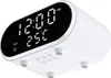 A white digital alarm clock with a black display showing the time and temperature. Produktbild-Vorschau
