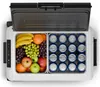 A top-down view of an open cooler box filled with fruits and canned drinks. Produktbild-Vorschau