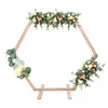 A hexagonal wooden arch decorated with flowers and balloons, set against a white background. Náhled obrázku produktu