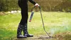 A person using a weed burner in a garden. Produktbild-Vorschau