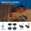 A child sleeping in bed next to a projection alarm clock. Produktbild-Vorschau