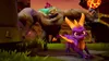A purple dragon and a large stone creature in a video game environment. Produktbild-Vorschau