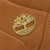 A close-up of a Timberland boot with the brand's tree logo. Produktbild-Vorschau