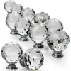 A collection of crystal cabinet knobs arranged in a diagonal line on a white background. Produktbild-Vorschau