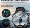 A smartwatch is shown in the foreground with a mountainous landscape in the background. The smartwatch displays weather and time information. Produktbild-Vorschau