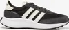 A side view of a black and white Adidas sneaker. Podgląd zdjęcia produktu