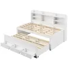 A white bed frame with a pull-out trundle bed and a headboard with shelves. Produktbild-Vorschau