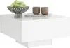 A modern white coffee table with a decorative bowl of green fruit and two brown ceramic cups on top. Voir les images du produit