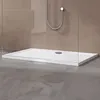 A modern white shower tray with a silver drain is shown in a bathroom setting with glass shower walls and a brown tiled background. Produktbild-Vorschau