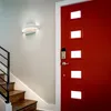 An interior hallway with a red door and a staircase. Produktbild-Vorschau
