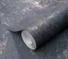 A roll of dark blue wallpaper with a textured, metallic-like pattern is shown diagonally, with the roll partially unrolled. Náhľad obrázku produktu