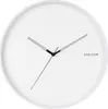 A minimalist white wall clock with black hands and the brand name 'KARLSSON' printed on the face. Anteprima dell’immagine prodotto