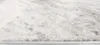 A close-up view of a rug's texture and edge. Voir les images du produit