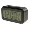 A black digital alarm clock with a large LCD screen displaying the time, alarm, date, and temperature. Náhled obrázku produktu