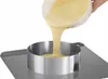 A cake ring is being filled with batter from a bowl. Podgląd zdjęcia produktu