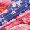 A close-up view of a floral patterned fabric, likely bedding, showing the texture and colors of the material. Anteprima dell’immagine prodotto