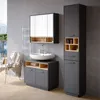 A modern bathroom vanity with a sink, mirror, and storage cabinets. Anteprima dell’immagine prodotto