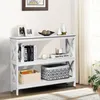 A white console table with three shelves, decorated with books, decorative items, and storage baskets. Produktbild-Vorschau