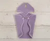 A purple fleece blanket and ear protector set laid flat on a wooden surface. Náhľad obrázku produktu