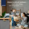 A mother and daughter are doing laundry together in a modern laundry room. Produktbild-Vorschau