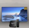 A TV screen displaying a beach scene, with a media player and remote control in the foreground. Náhled obrázku produktu