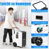 A man is pushing a commercial dehumidifier with wheels in a warehouse. Produktbild-Vorschau