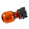 A close-up studio shot of an amber-colored light bulb with a black base. Produktbild-Vorschau